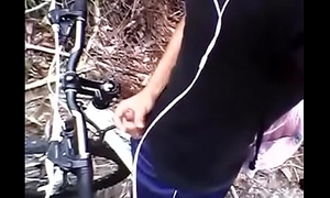 Cyclist passionately cums in the sum total of a tropical rainforest