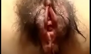 Hairy Asian catholic masturbations in excess of her period
